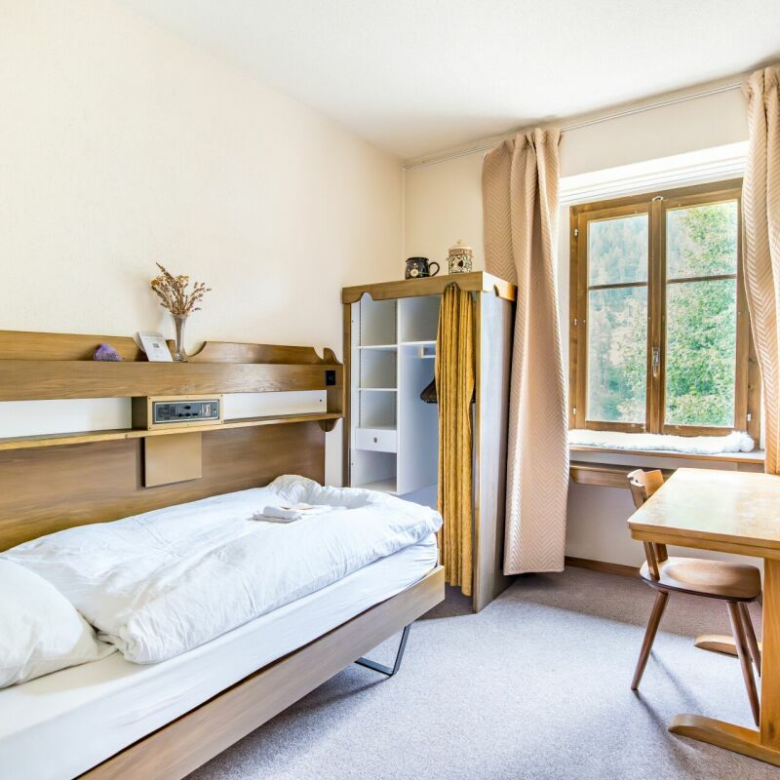 Former hotel with exceptional potential, enjoying a dreamlike panoramic location in Lötschental
