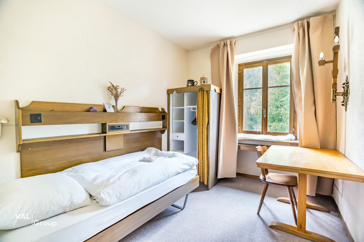 Former hotel with exceptional potential, enjoying a dreamlike panoramic location in Lötschental